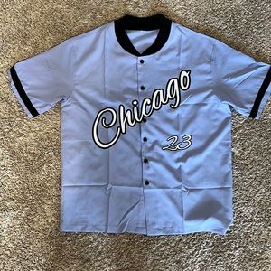 Cute baby blue/light light purple flannel/button up with the word “Chicago 23”